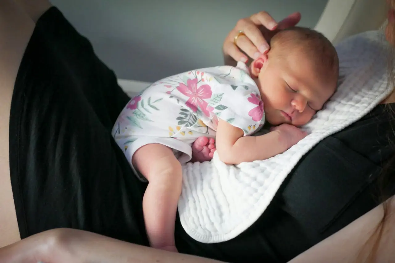 Peaceful baby sleeping in a cot — sleep training methods for Australian parents